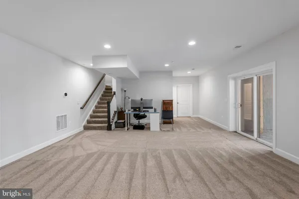 a view of a house with a yard from a balcony