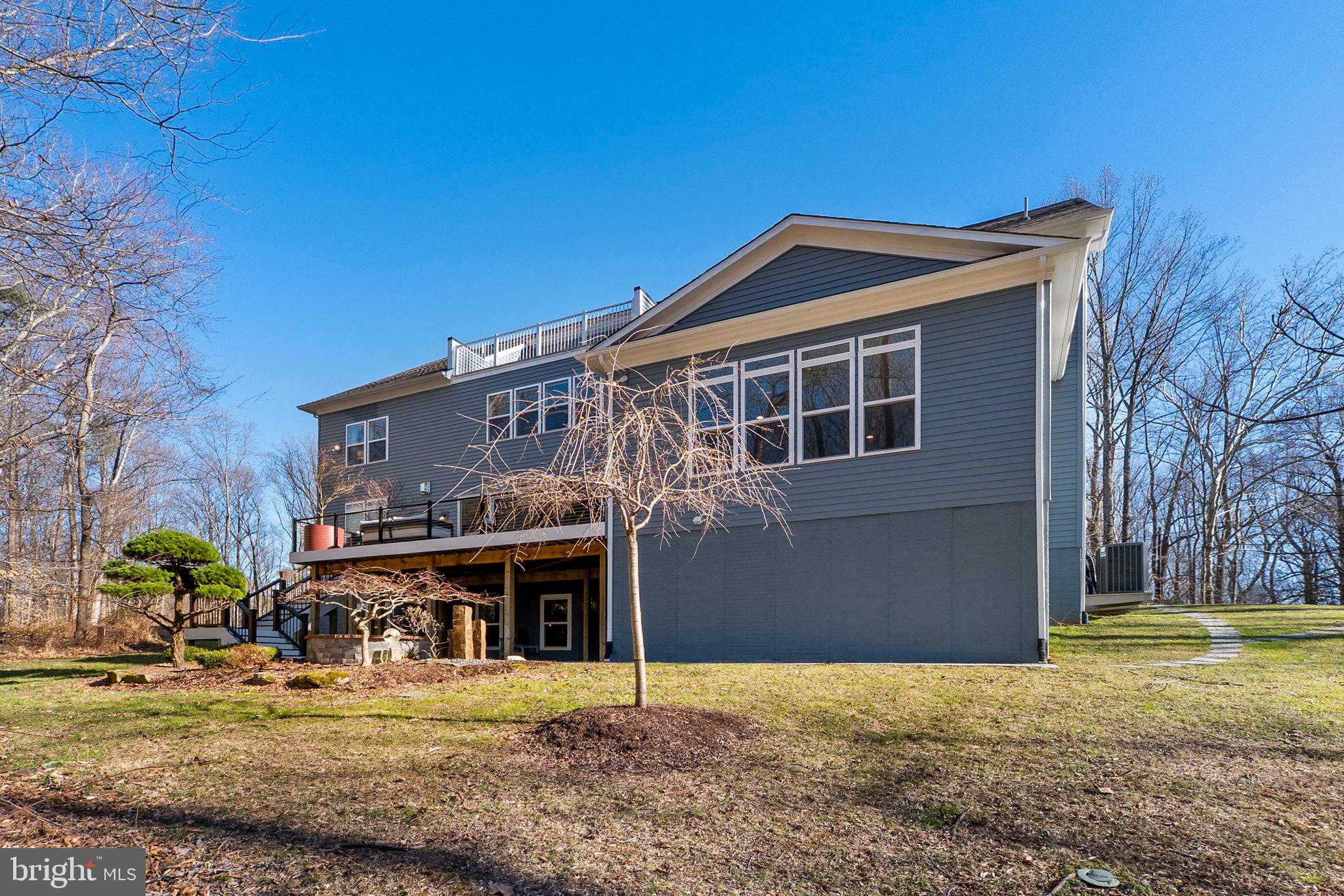 11760 Glen Mill Road Potomac, MD 20854 - Photo 49 of 64 a front view of a house with garden