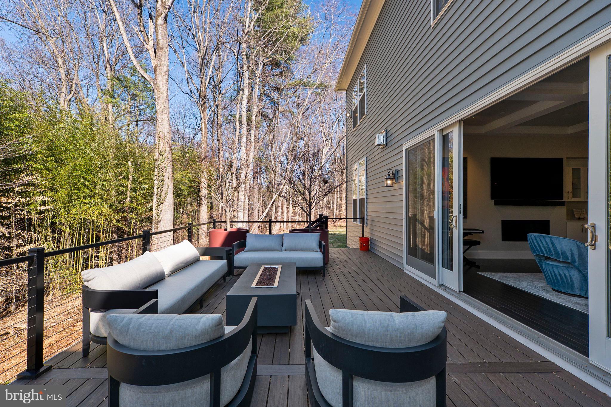 11760 Glen Mill Road Potomac, MD 20854 - Photo 51 of 64 a outdoor space with patio the couches and a potted plant