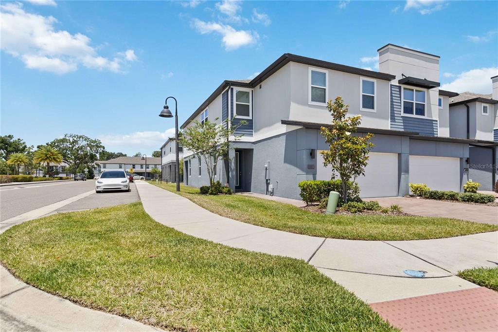 a front view of a house with garden