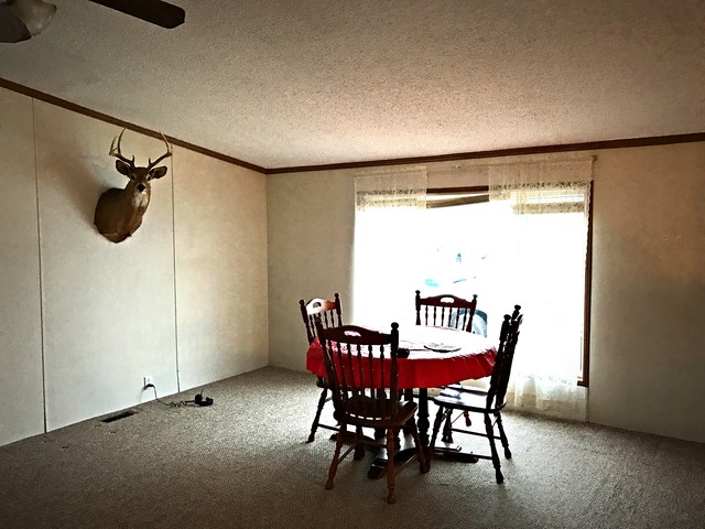 3557 East 1925th Road Ottawa, IL 61350 - Photo 10 of 20 a view of a dining room with furniture and a window