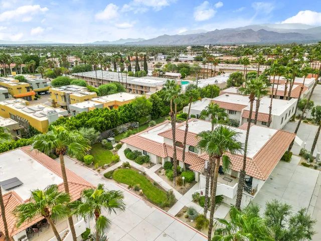 a view of a city with lawn chairs