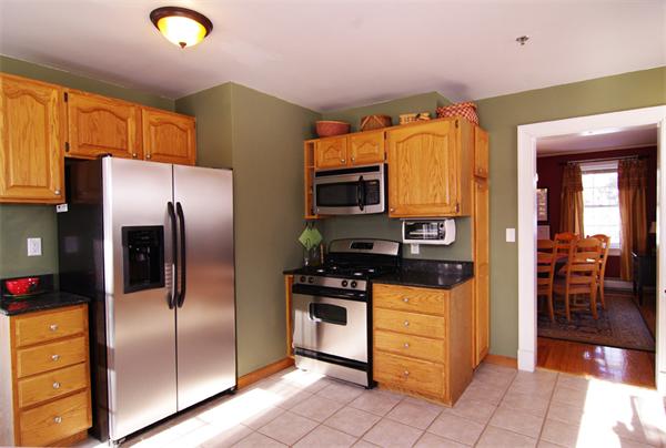 37 Walnut Street Harvard, MA 01451 - Photo 1 of 1 a kitchen with stainless steel appliances granite countertop a refrigerator a stove and a sink