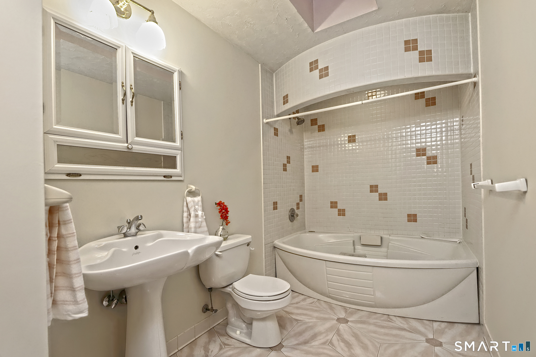 95 Ash Drive Hamden, CT 06518 - Photo 27 of 37 Main Bath with Jacuzzi Tub & Shower. Ceramic tile in beautiful condition.