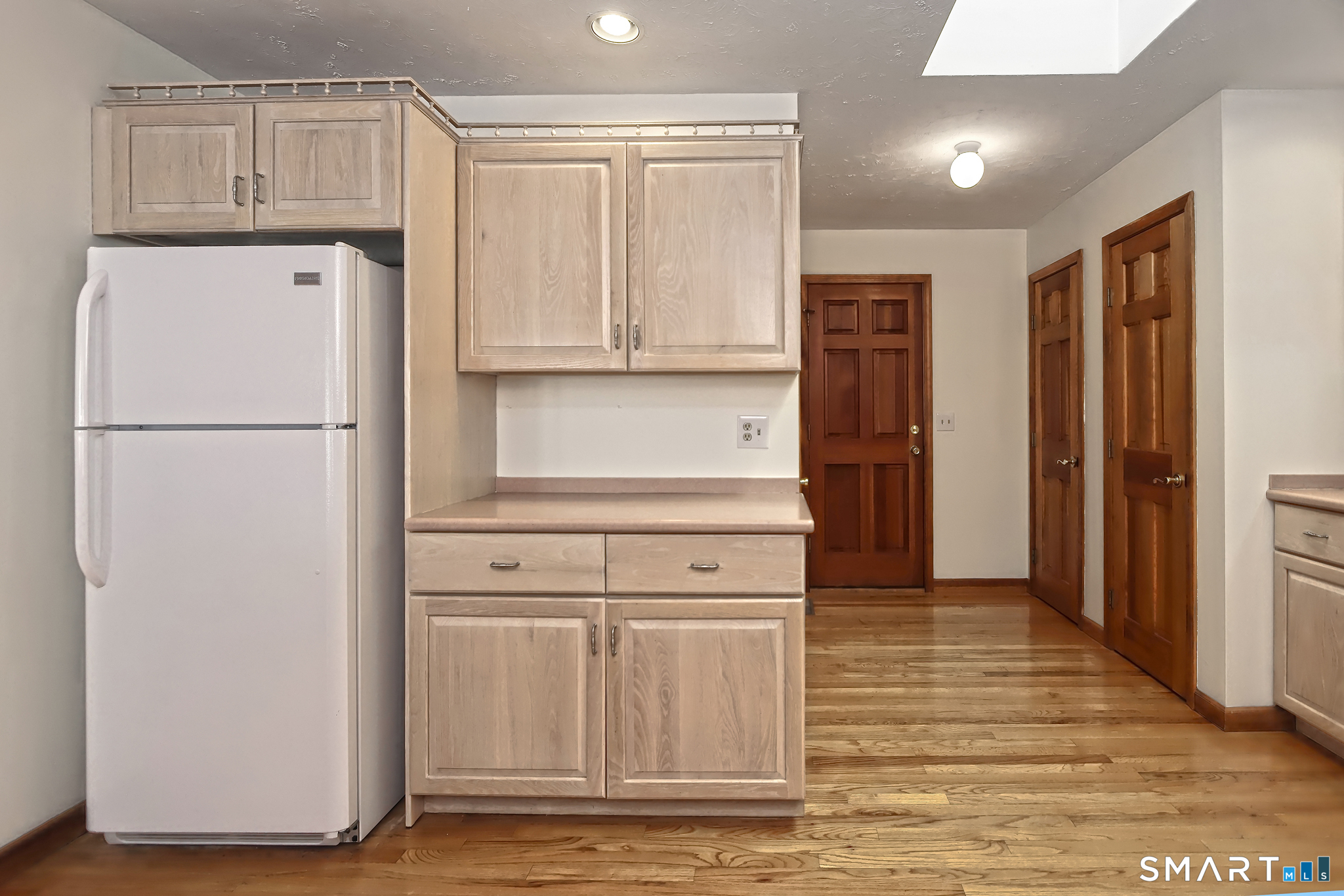 95 Ash Drive Hamden, CT 06518 - Photo 3 of 37 Kitchen View to Garage, Pantry and Laundry Room.
