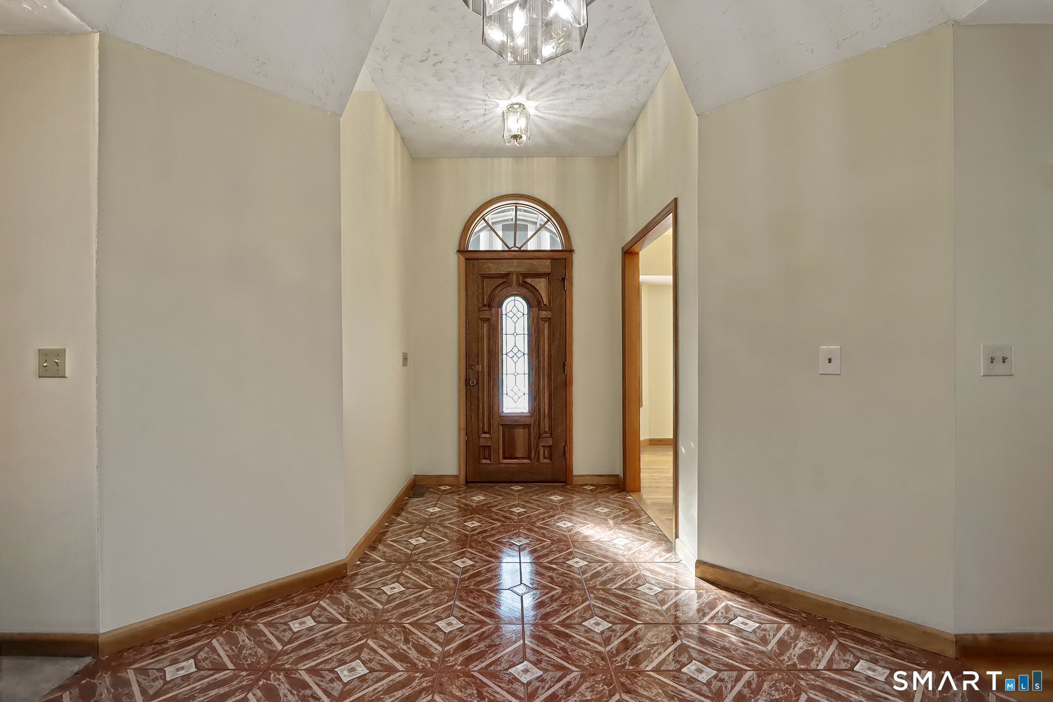 95 Ash Drive Hamden, CT 06518 - Photo 8 of 37 Interior Foyer to Front Door and Formal Dining. Artistic quality ceramic tile.