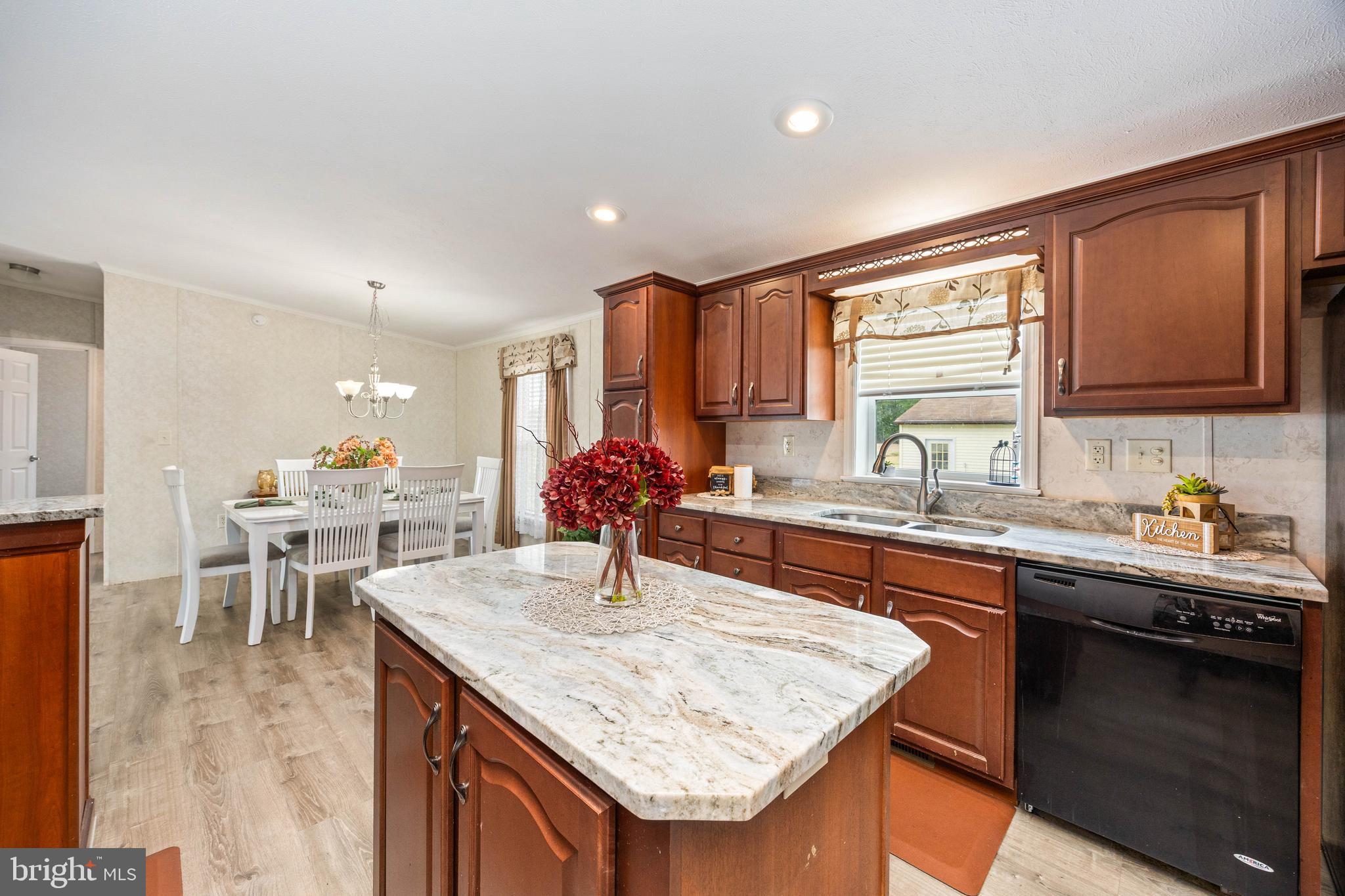 4258 Smith Road Salisbury, MD 21801 - Photo 24 of 43 a kitchen with center island table and chairs in it