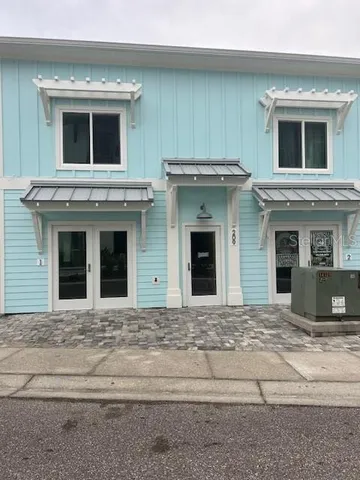 a view of a house with a door and a fireplace