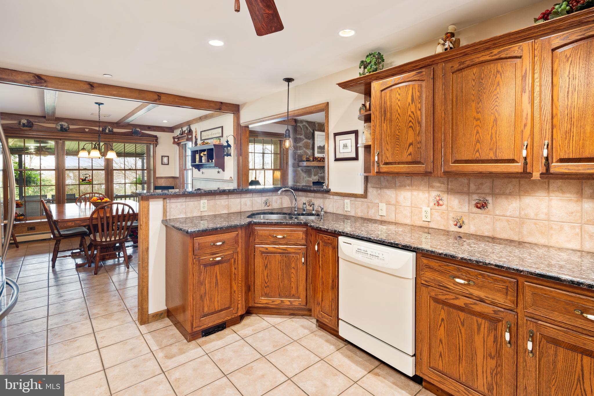 3556 Smith Road Furlong, PA 18925 - Photo 15 of 57 a kitchen with stainless steel appliances granite countertop a sink and cabinets