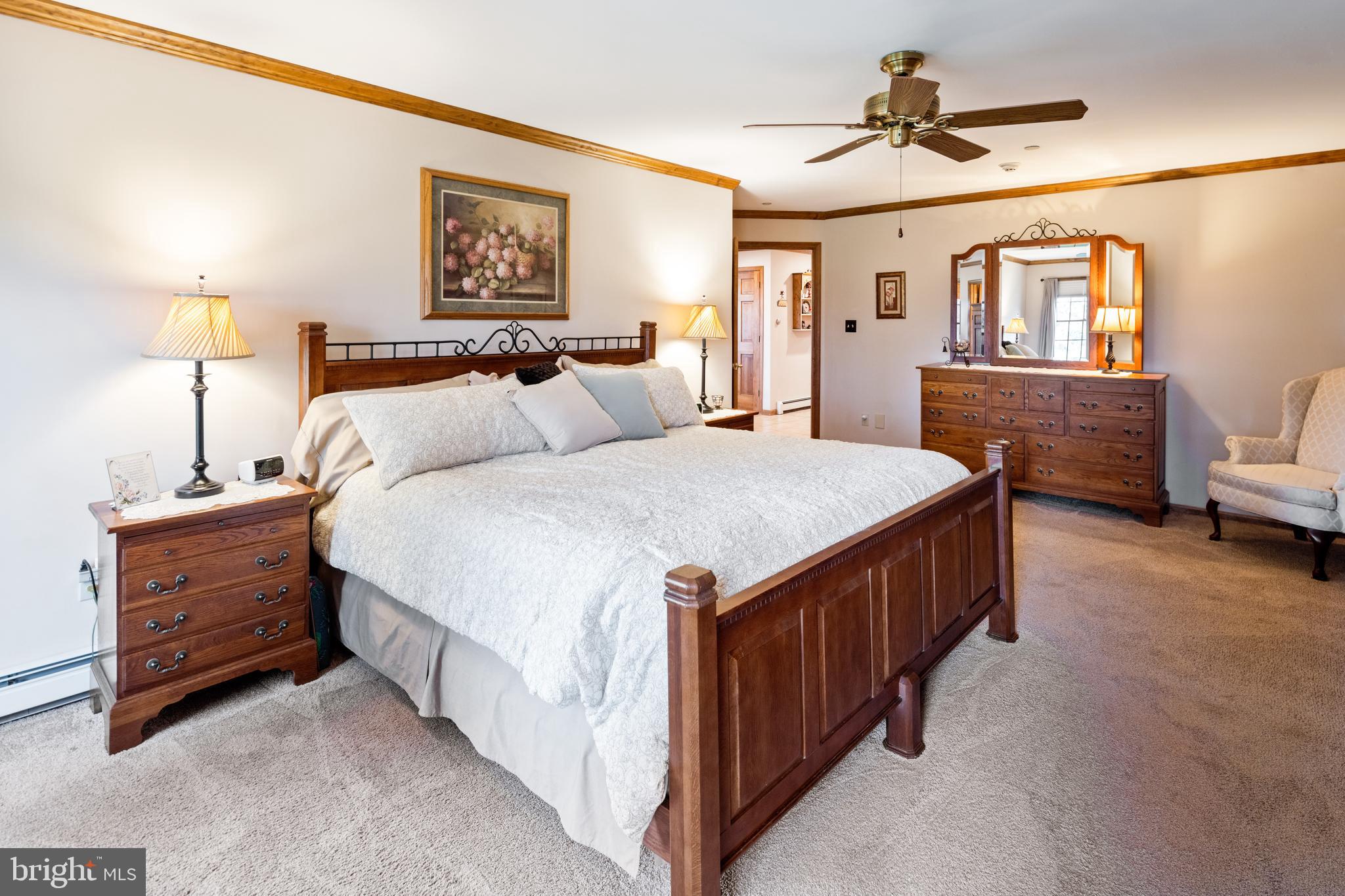 3556 Smith Road Furlong, PA 18925 - Photo 17 of 57 a bed room with a bed and a lamp