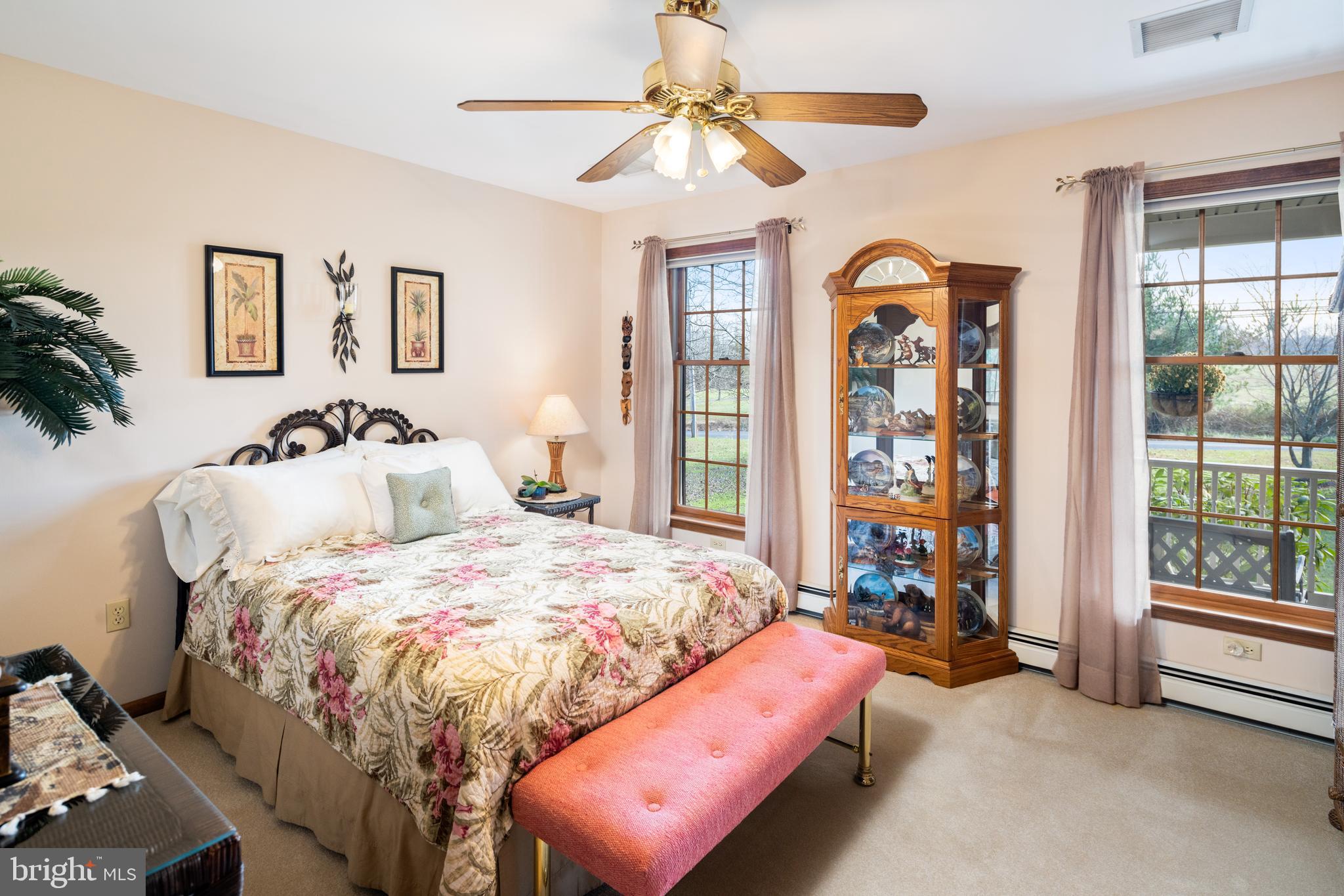 3556 Smith Road Furlong, PA 18925 - Photo 21 of 57 a bedroom with a bed and a chandelier