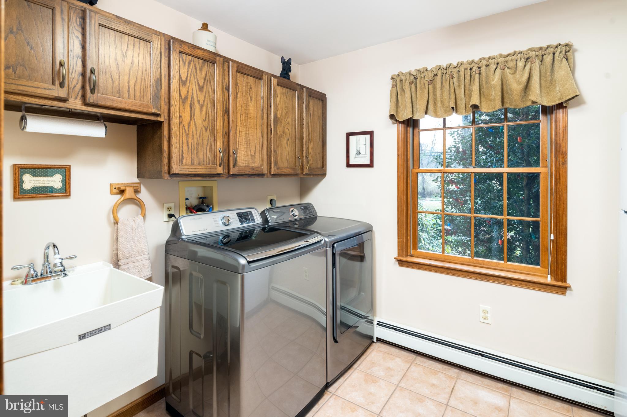 3556 Smith Road Furlong, PA 18925 - Photo 23 of 57 a kitchen with a refrigerator a sink and cabinets