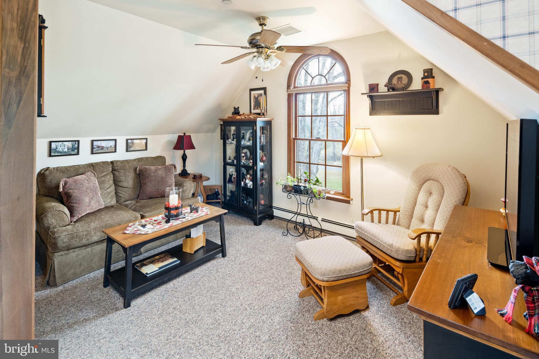 3556 Smith Road Furlong, PA 18925 - Photo 27 of 57 a living room with furniture a rug and a window