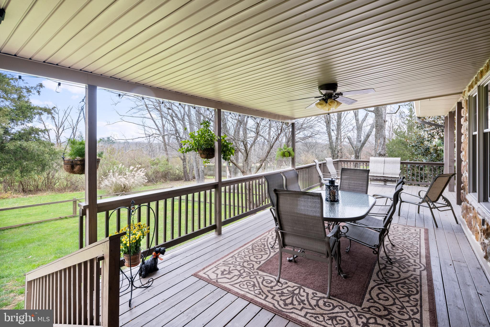 3556 Smith Road Furlong, PA 18925 - Photo 35 of 57 a view of a chairs and table in patio with wooden fence