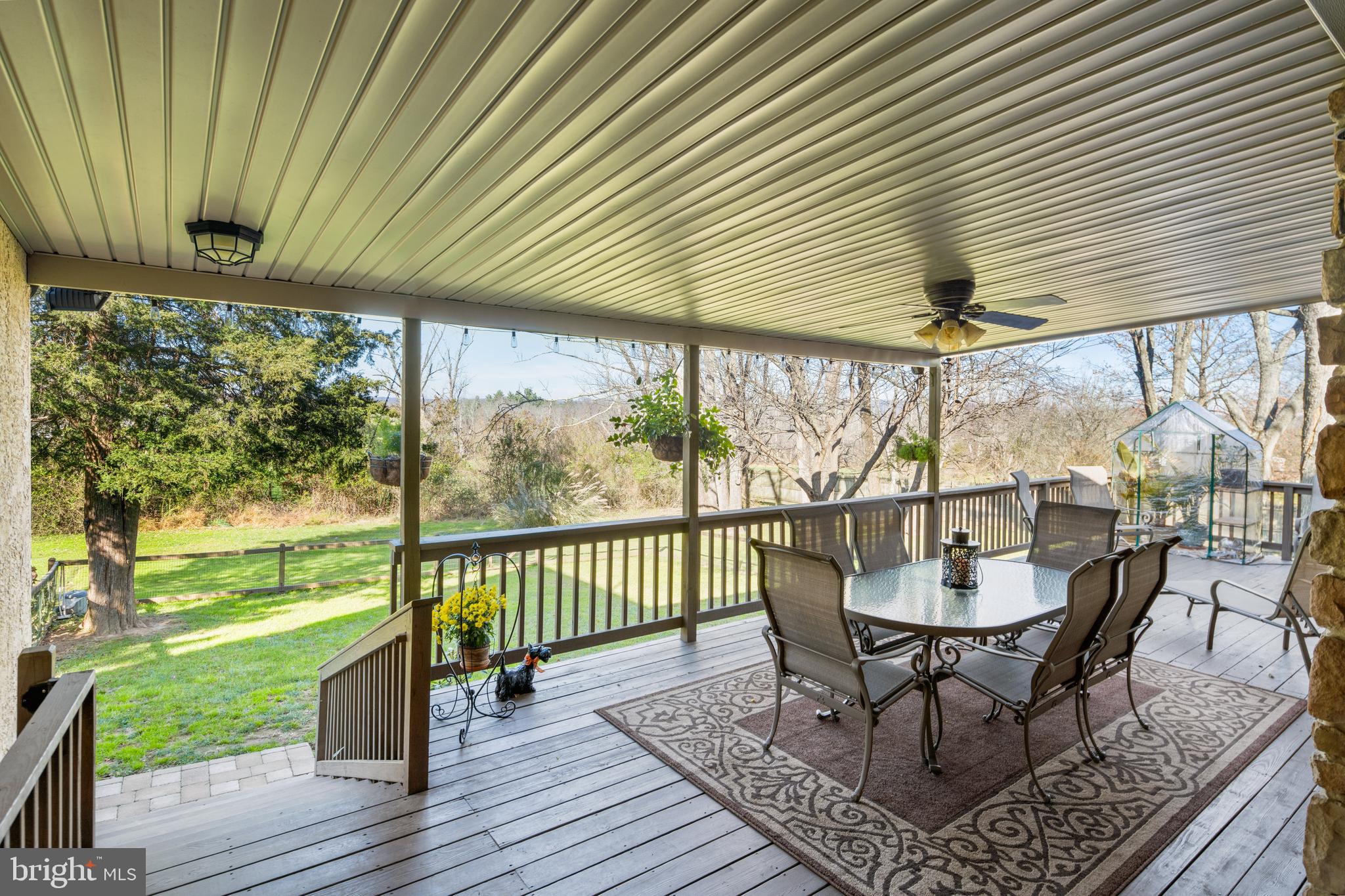 3556 Smith Road Furlong, PA 18925 - Photo 37 of 57 a dining room with wooden floor outdoor seating and nature