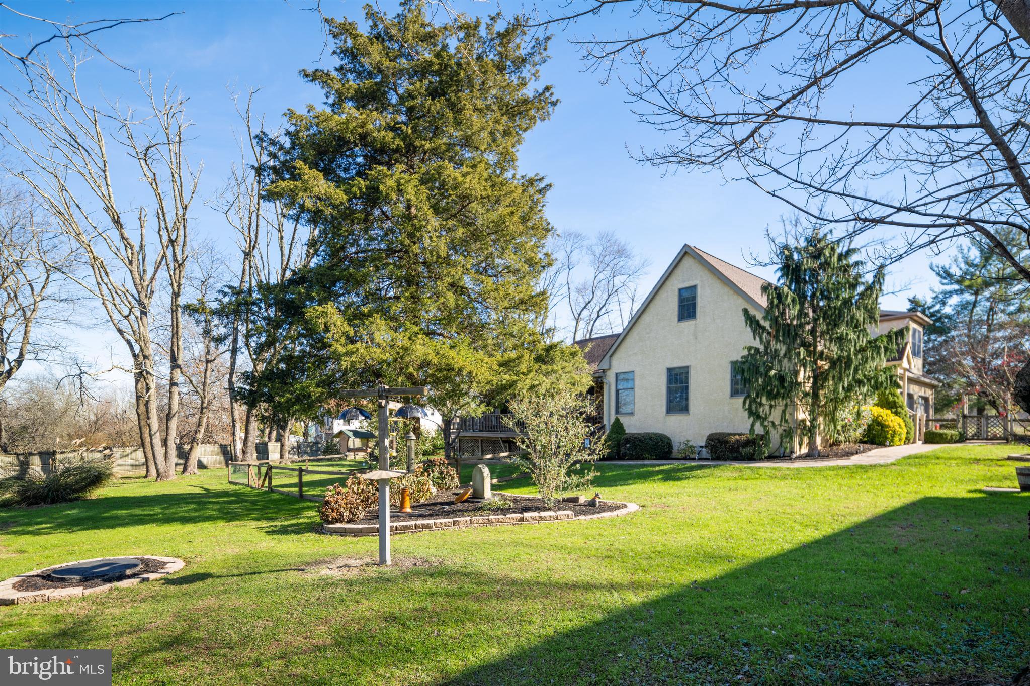 3556 Smith Road Furlong, PA 18925 - Photo 41 of 57 a front view of a house with a yard and trees