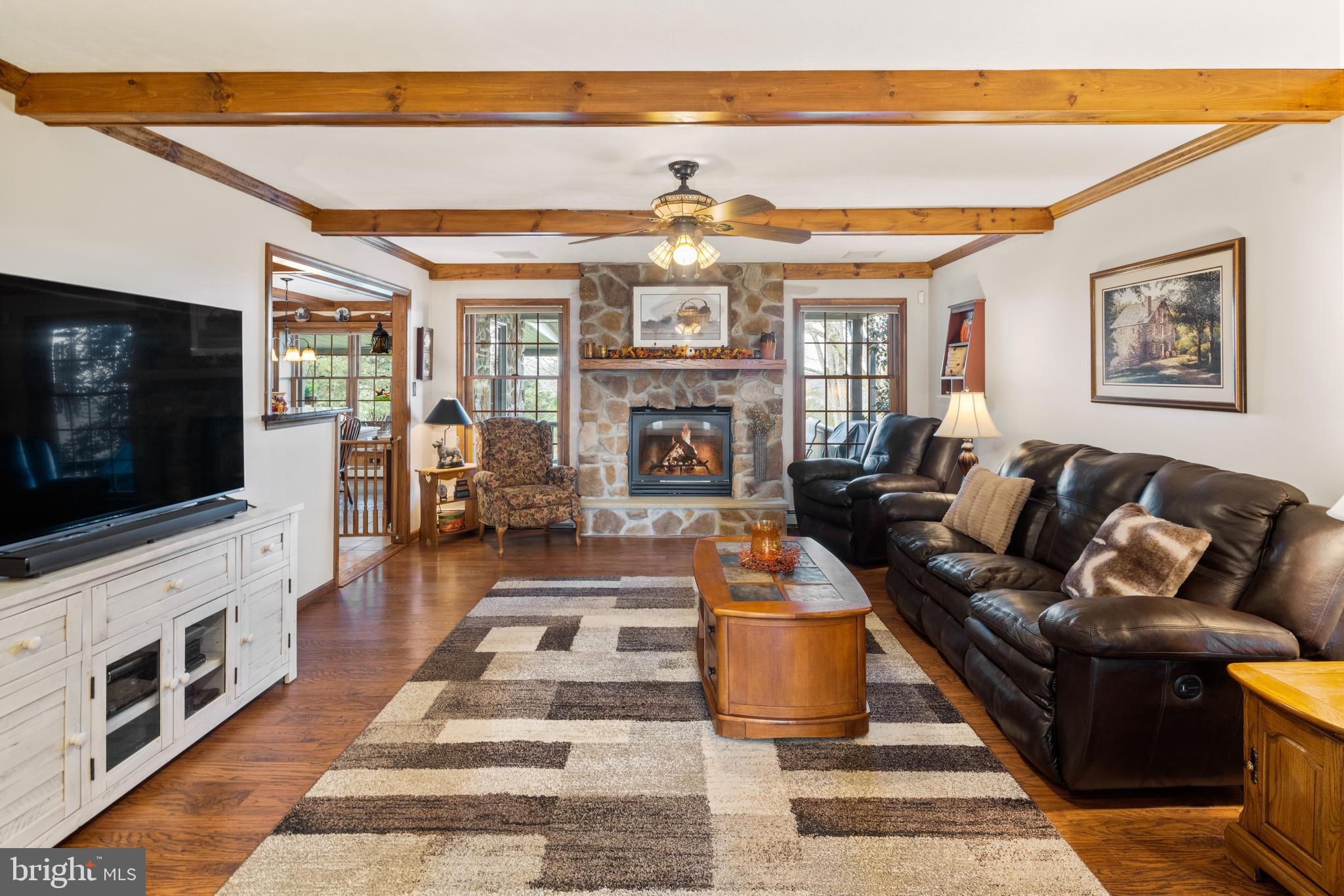 3556 Smith Road Furlong, PA 18925 - Photo 9 of 57 a living room with fireplace furniture and a flat screen tv