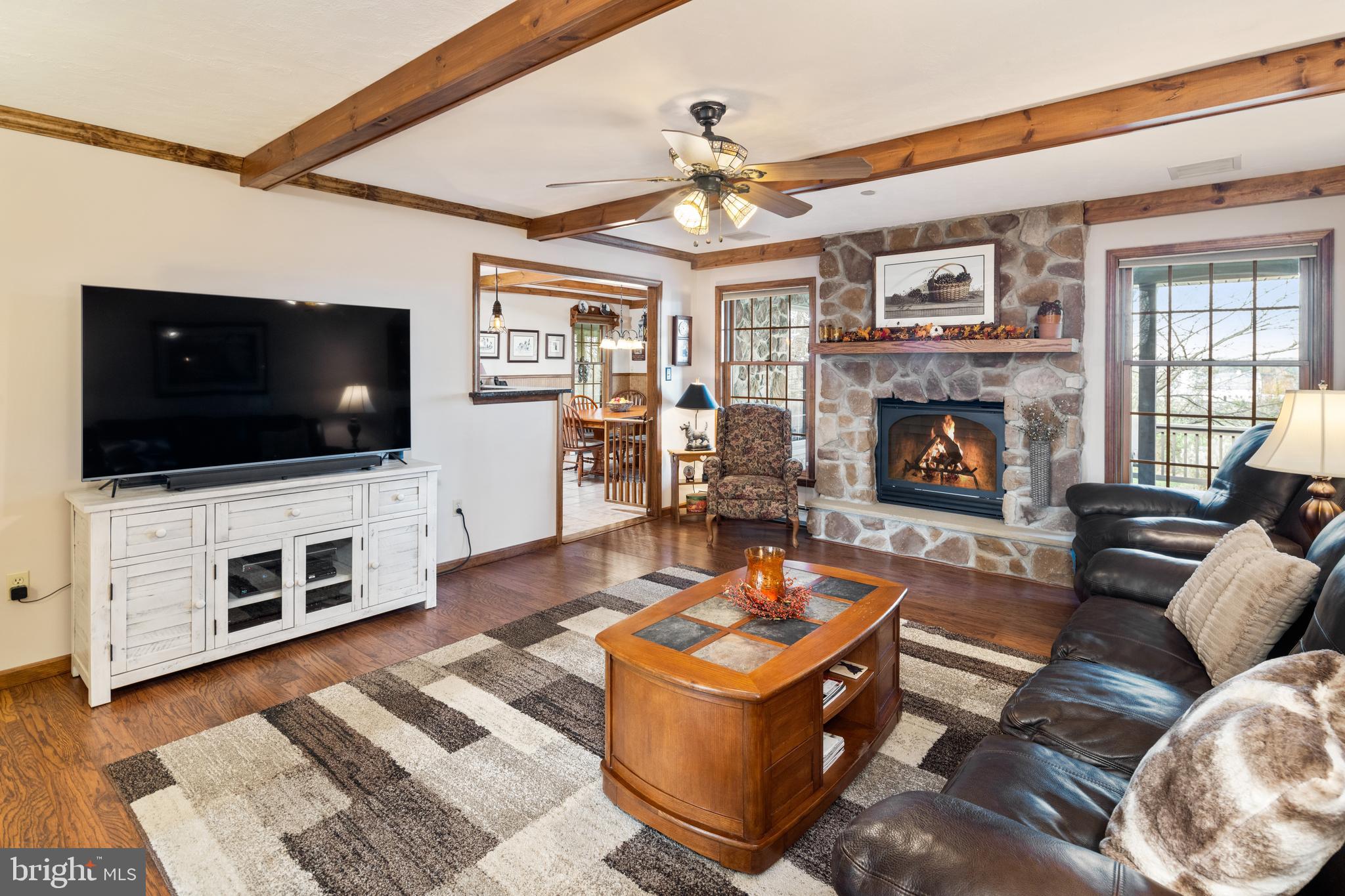 3556 Smith Road Furlong, PA 18925 - Photo 10 of 57 a living room with furniture and a flat screen tv