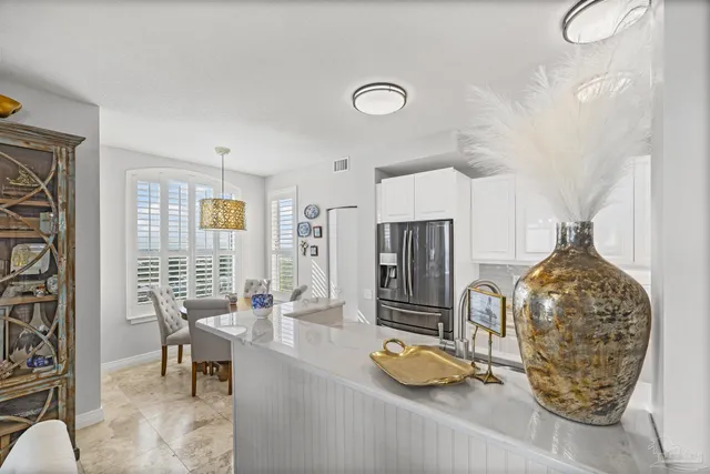 a kitchen with sink a stove and cabinets