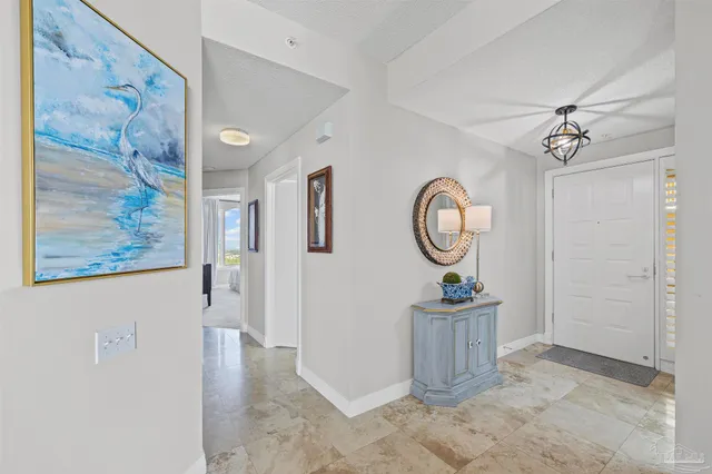 a bedroom with a bed a couch and a large window