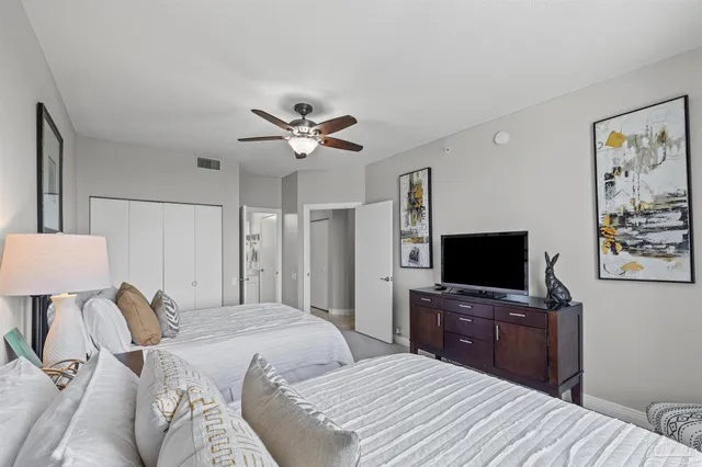 a view of a house with a wooden deck