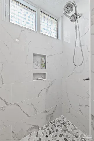 a view of a patio with couches table and chairs and potted plants