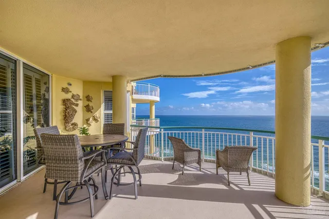 a front view of a building with outdoor seating