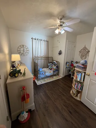 a bed room with furniture and wooden floor