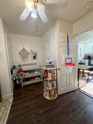 a bedroom with furniture and a chandelier