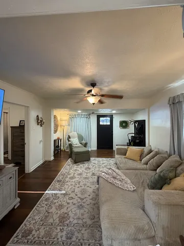 a view of a livingroom with furniture window and a fireplace