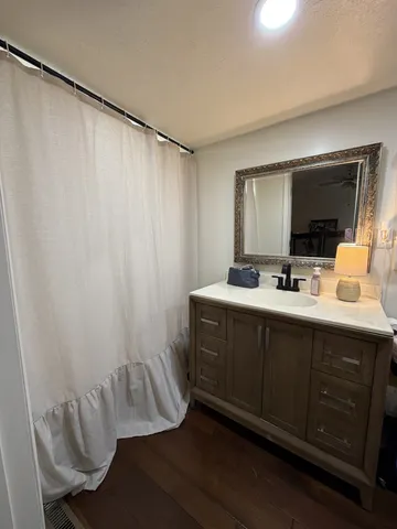a bathroom with a double vanity sink and a mirror