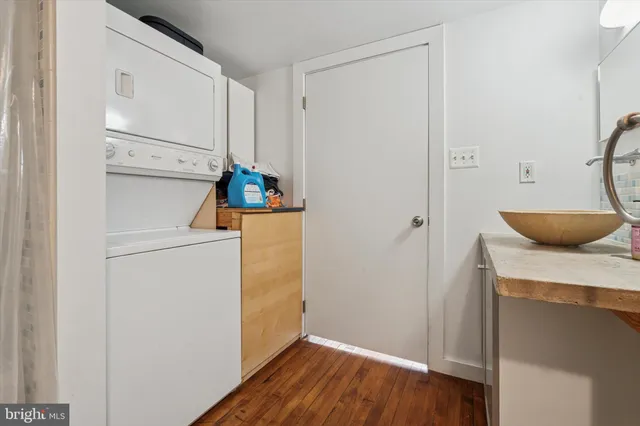 a view of hallway with wooden floor