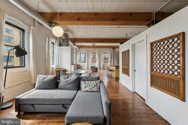 a living room with furniture and a rug