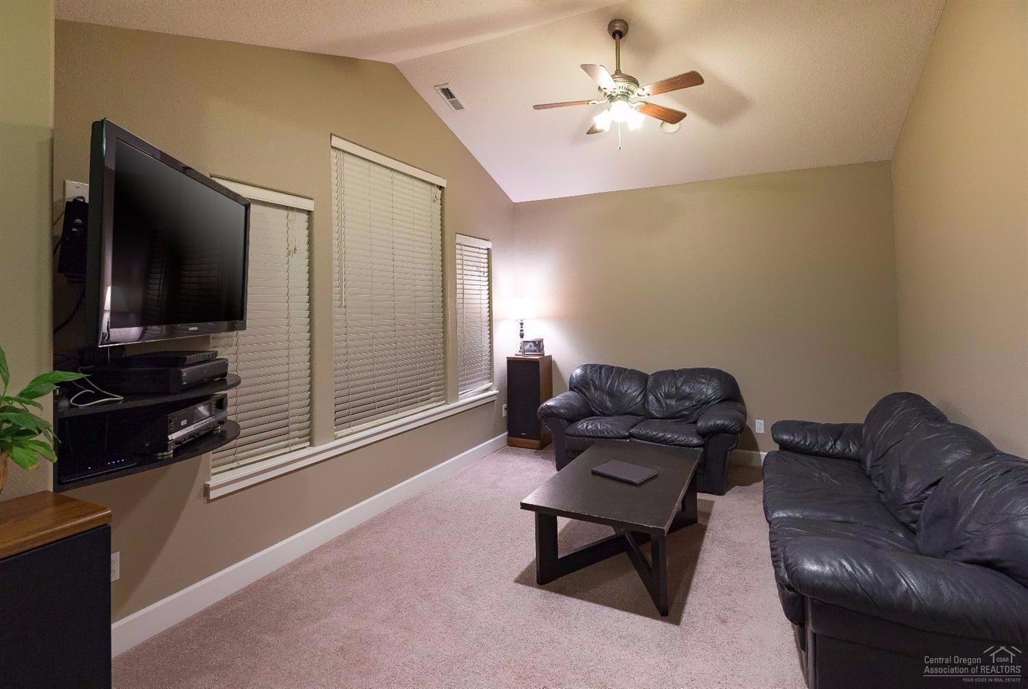 61468 Brosterhous Road Bend, OR 97702 - Photo 10 of 18 Head upstairs to the vaulted bonus room.