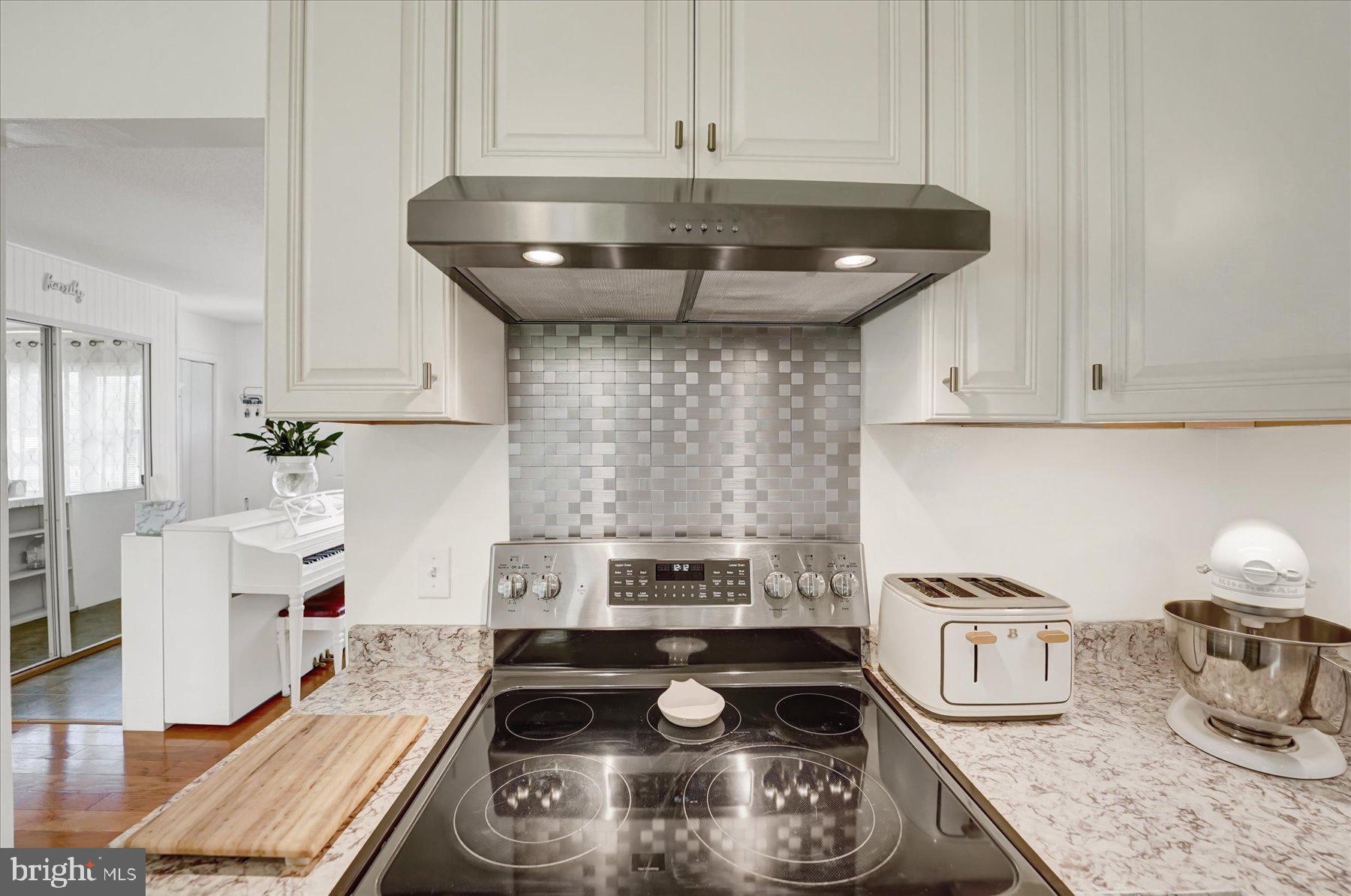 4814 West Whitehall Road Pennsylvania Furnace, PA 16865 - Photo 13 of 43 a kitchen with appliances a stove and cabinets