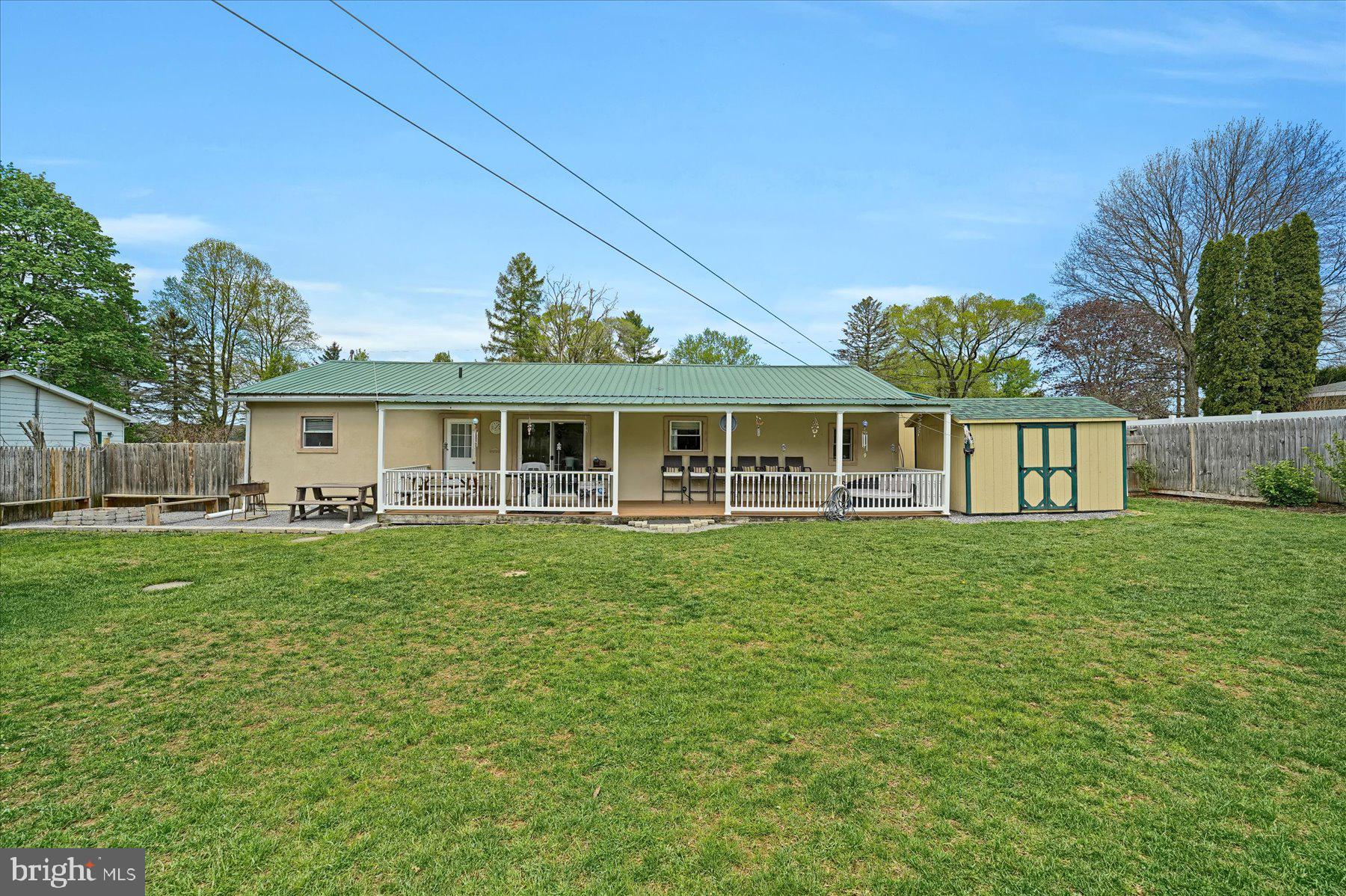 4814 West Whitehall Road Pennsylvania Furnace, PA 16865 - Photo 2 of 43 a front view of a house with a garden