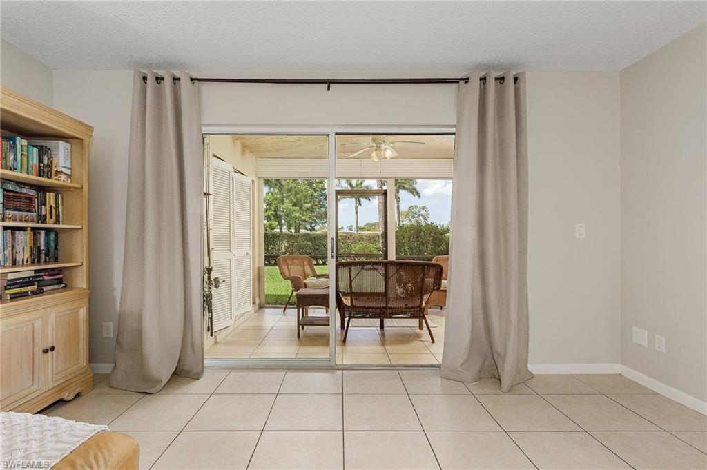 5789 Gage Lane, Unit A 103 Naples, FL 34113 - Photo 13 of 26 a view of room with window and table chair