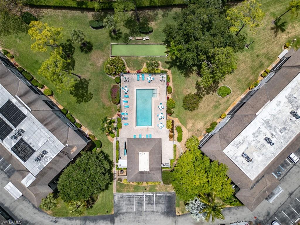 5789 Gage Lane, Unit A 103 Naples, FL 34113 - Photo 25 of 26 an aerial view of a house with a garden and lake view