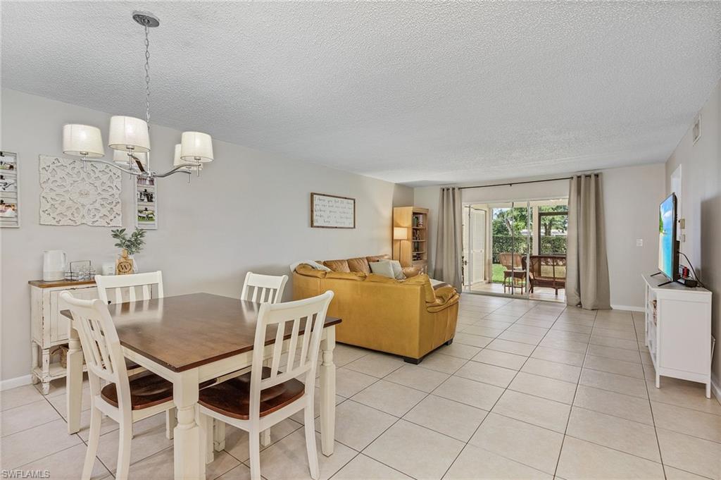 5789 Gage Lane, Unit A 103 Naples, FL 34113 - Photo 10 of 26 a view of a livingroom with furniture and window
