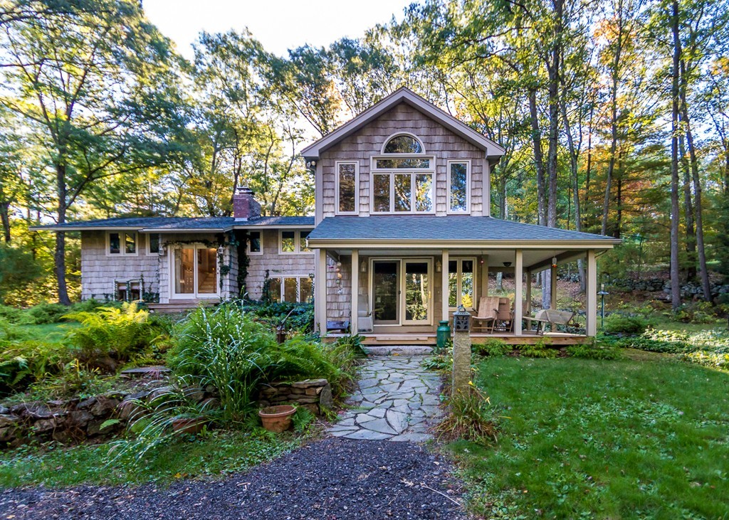 93 Old County Road Lincoln, MA 01773 - Photo 1 of 30 a front view of a house with garden