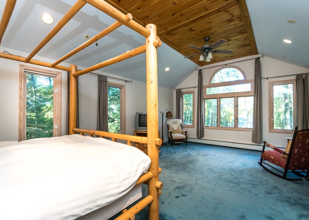 93 Old County Road Lincoln, MA 01773 - Photo 12 of 30 a spacious bedroom with a bed and a large window
