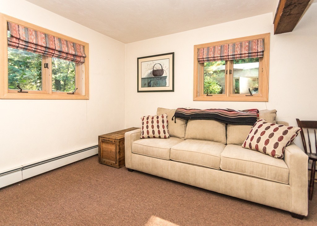 93 Old County Road Lincoln, MA 01773 - Photo 14 of 30 a living room with a couch and a window