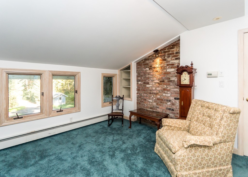 93 Old County Road Lincoln, MA 01773 - Photo 16 of 30 a living room with furniture and a large window