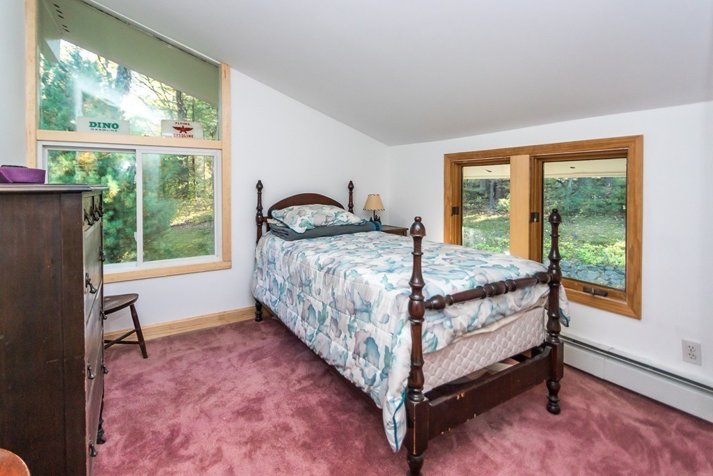 93 Old County Road Lincoln, MA 01773 - Photo 17 of 30 a bedroom with a bed chair and window