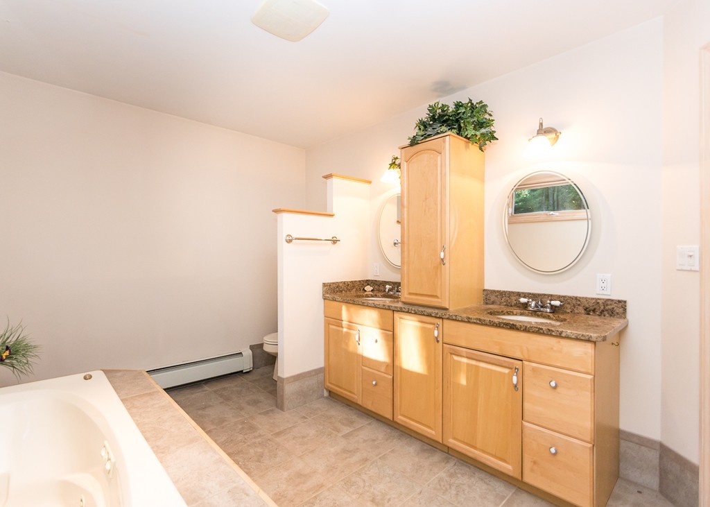 93 Old County Road Lincoln, MA 01773 - Photo 19 of 30 a kitchen with a stove and cabinets