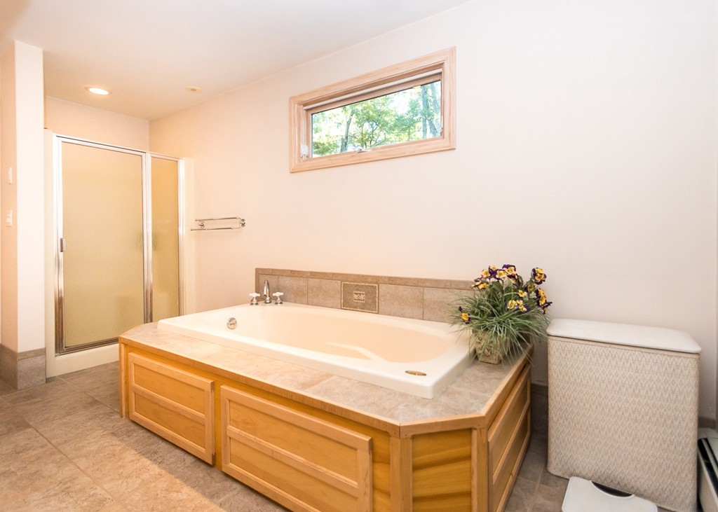 93 Old County Road Lincoln, MA 01773 - Photo 20 of 30 a spacious bathroom with a tub and shower