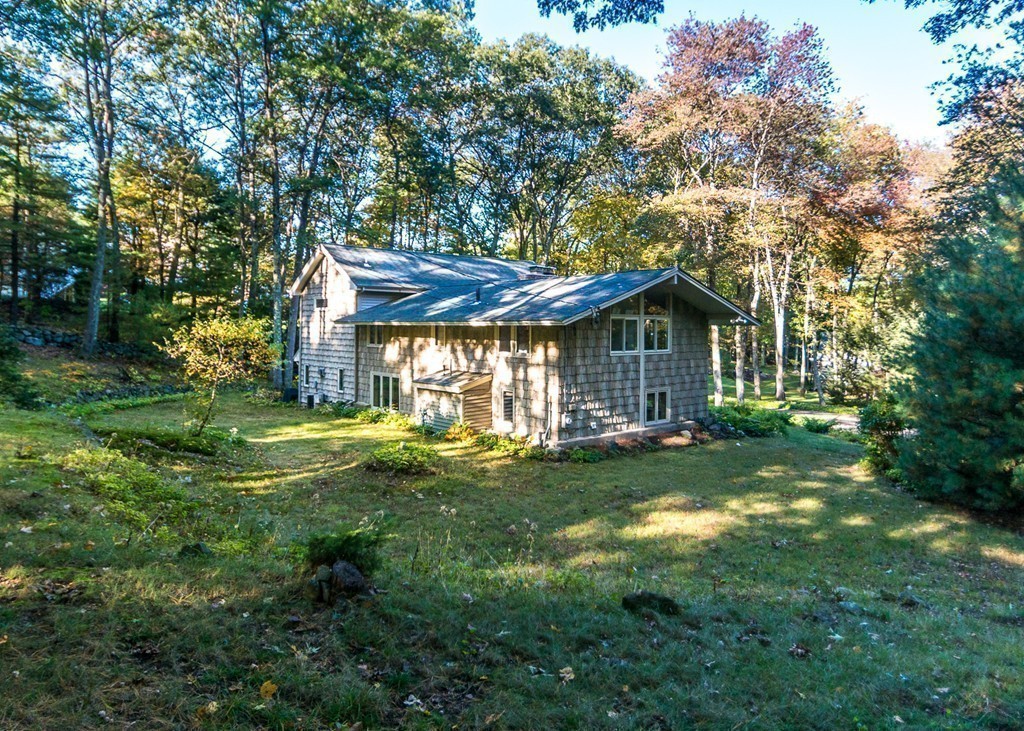 93 Old County Road Lincoln, MA 01773 - Photo 24 of 30 a view of a house with a yard and sitting area