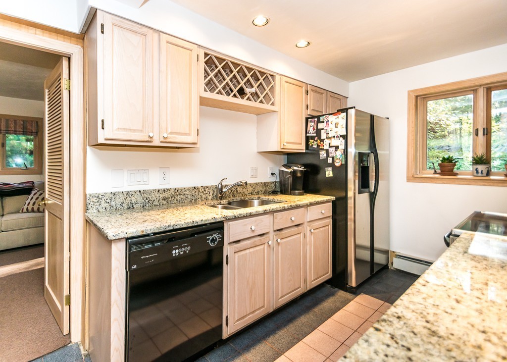 93 Old County Road Lincoln, MA 01773 - Photo 5 of 30 a kitchen with a sink stove and refrigerator