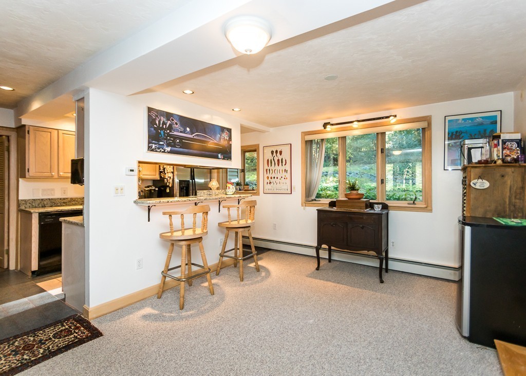 93 Old County Road Lincoln, MA 01773 - Photo 6 of 30 a view of a livingroom with workspace and a window
