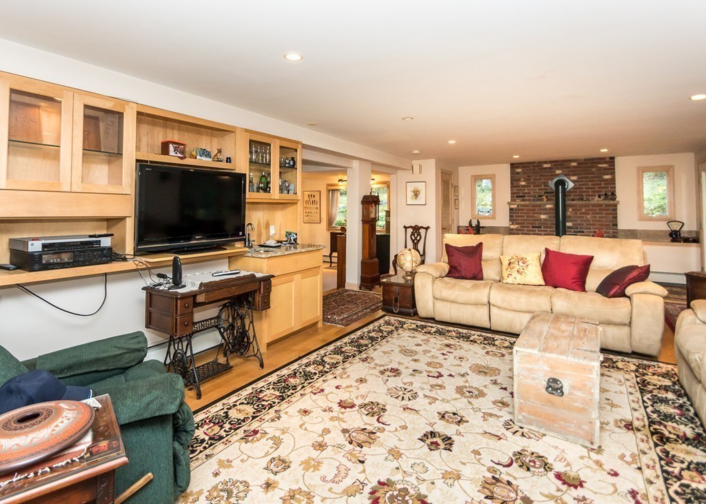 93 Old County Road Lincoln, MA 01773 - Photo 7 of 30 a living room with furniture and a flat screen tv